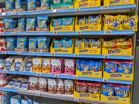 France, 30 September 2024 : Supermarket candy aisle showcasing M&M's and Lindt chocolates