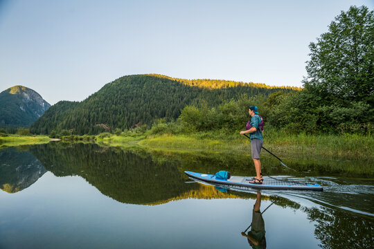 Side view of man paddling an SUP in Widgeon Marsh., Pitt Meadows.