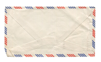 front view of old closed aged airmail DL envelope with faded stamp isolated on white