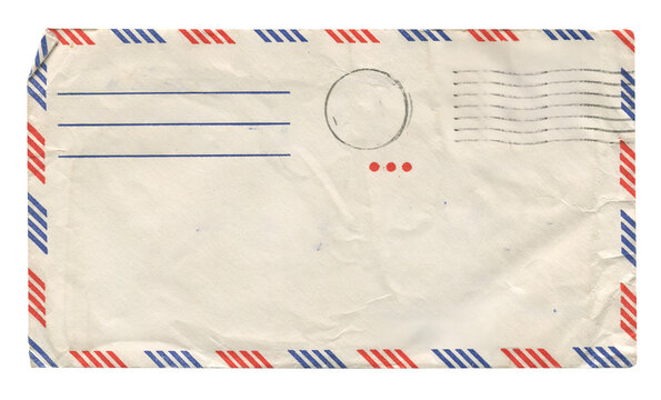 back view of old closed aged airmail DL envelope with faded stamp isolated on white