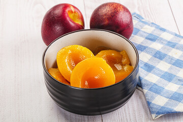 Canned peaches with sweet syrope