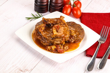 Italian cuisine - ossobuco with sauce