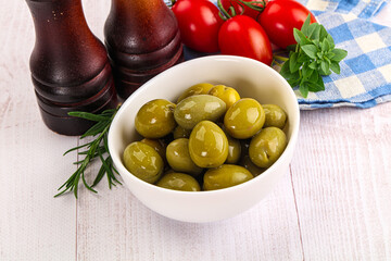 Green marinated olives in the bowl