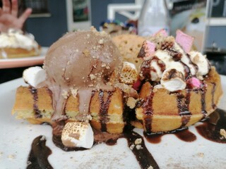 chocolate ice cream on a waffle. 