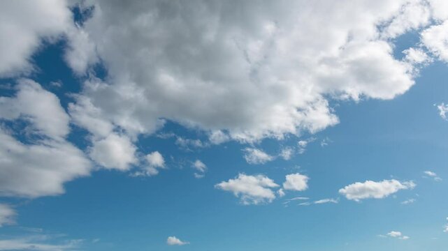 Time lapse of flow of the puffy clouds in blue sky. Beautiful sunny sky fresh air