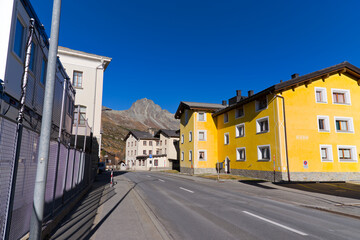 Alpine mountain panorama at Swiss mountain village of Maloja with road on a sunny autumn day. Photo taken November 15th, 2024, Maloja Bregaglia, Switzerland.