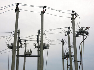 many power poles on the edge of the city