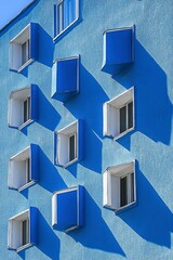 Blue Building Facade With Geometric Windows