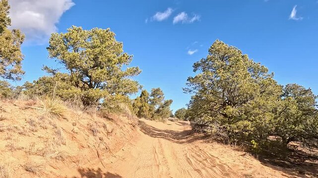 Kanab Utah ride desert mountain recreation trail POV. Off road trail riding in 4x4 all terrain vehicle for sport and recreation. Desert landscape, dusty trails and recreation areas. Southwest Utah