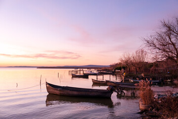 Fototapeta premium Winter morning on the Razim saltwater lake in the traditional fishing village of Sarichioi, one of the largest lakes in Romania, part of the Danube Delta Biosphere Reserve, Tulcea County, Romania