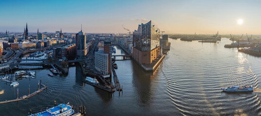 View of Hamburg's harbor with Elbphilharmonie, canals, boats, and the city's architectural skyline....