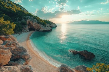 Serene beach at sunset with turquoise waters and lush green cliffs in the background on a calm evening