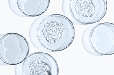 Skin serum or face wash gel in a Petri dish. For cosmetic procedures. White background