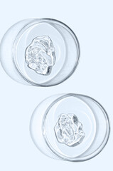 A sample of skin serum or moisturizing gel in a Petri dish. A cosmetic product.
