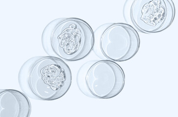 A sample of skin serum or moisturizing gel in a Petri dish. A cosmetic product.