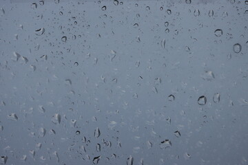 Abstract background of water drops on a window.