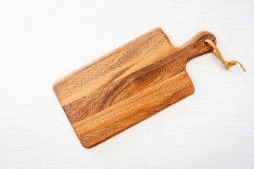 Wooden cutting board on white background