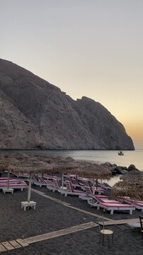 View of the black beach in the city of Perissa Santorini Greece