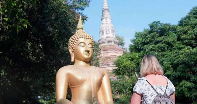 A young female tourist in the ancient city Chiang Saen in Thailand