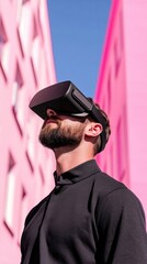 A person wearing a VR headset is immersed in an augmented reality environment, standing between pink buildings, under a clear blue sky.