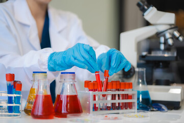 Female biotechnologist testing new chemical substances in a laboratory.