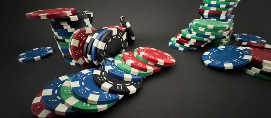 red dice, cards and poker chips, on a black background 