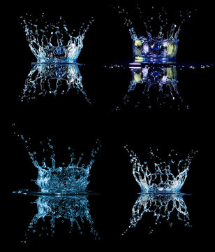 Set of four blue splashes of water drops on black background