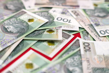 Value growth graphics. Red graph, Polish cash banknotes, one hundred zloty. Economics and business.
