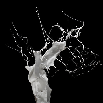 Energetic splash of milk or white paint isolated on black background