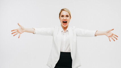Happy confident business blonde director or general manager rejoices on a white studio background....