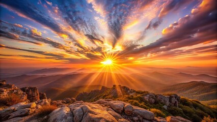 Majestic Sunrise Illuminates Rolling Mountain Ranges, Casting Golden Rays Across a Rocky Peak
