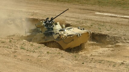 armored personnel carrier overcomes water obstacles
