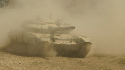 heavy tank at full speed in the dust