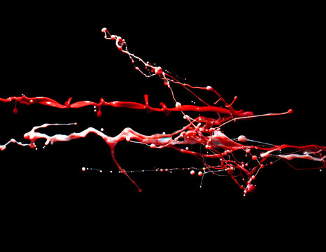 splash and splatter of paint isolated on black background