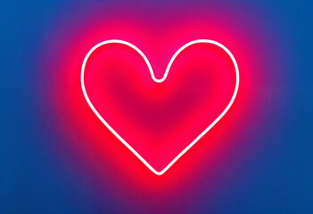 Romantic neon heart with bright glow on blue background
