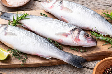 Raw sea bass fish photography . Top view