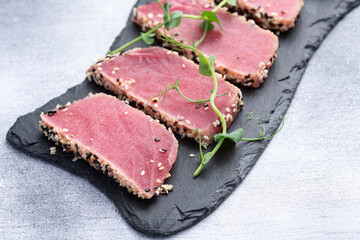 Sliced tuna steak with sesame photography . Top view