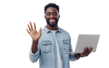 Happy man in a denim shirt holding a laptop in one hand and waving with the other, displaying a cheerful expression, set against a plain white background.

