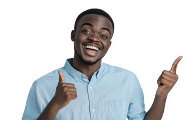 Laughing man in a light blue shirt pointing to the side with both hands, standing against a pastel gray background.

