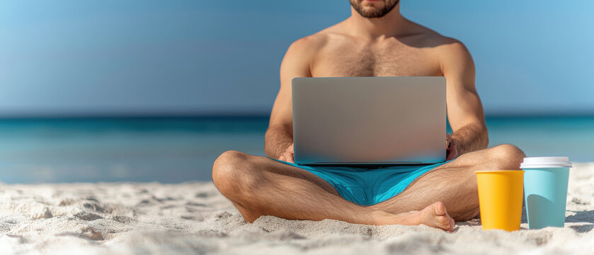 Digital nomad remote work concept, A man sits cross-legged on the beach, working on a laptop with colorful cups nearby, enjoying the calm ocean view.