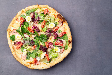 Italian pizza caesar with eggs salad chicken tomatoes and mozzarella photography. top view