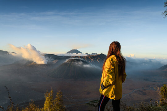 Woman standing in front of Mount Bromo, East Java, Indonesia