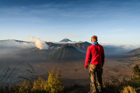 Man standing in front of Mount Bromo, East Java, Indonesia