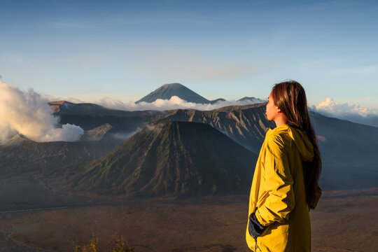 Woman standing in front of Mount Bromo, East Java, Indonesia