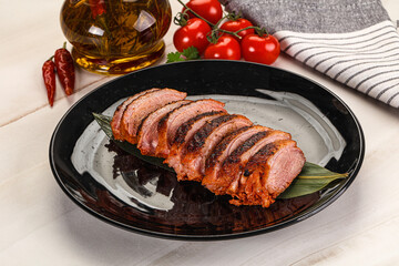 Sliced duck breast baked with cherry