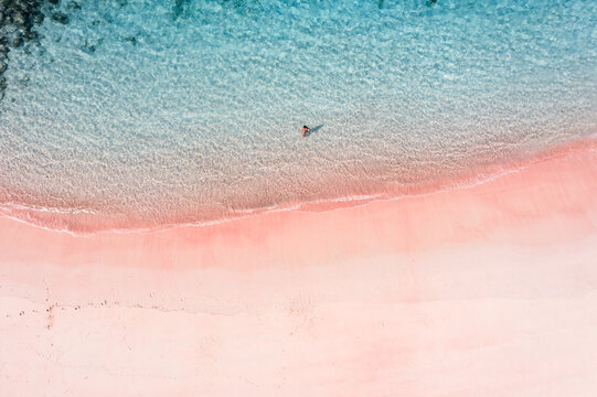 Aerial view of woman at Pink Beach, Komodo National Park, Indonesia