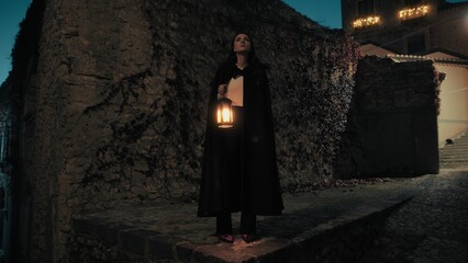 Mysterious Woman With Cloak And Lantern Explores A Night City