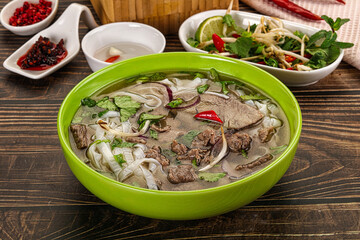 Vietnamese Pho Bo soup with beef and noodles