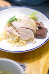 Steamed rice topped with chicken. Close up