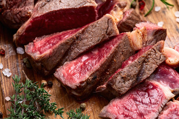 Ribeye grilled  beef steak sliced . Rare doneness photography . Top view